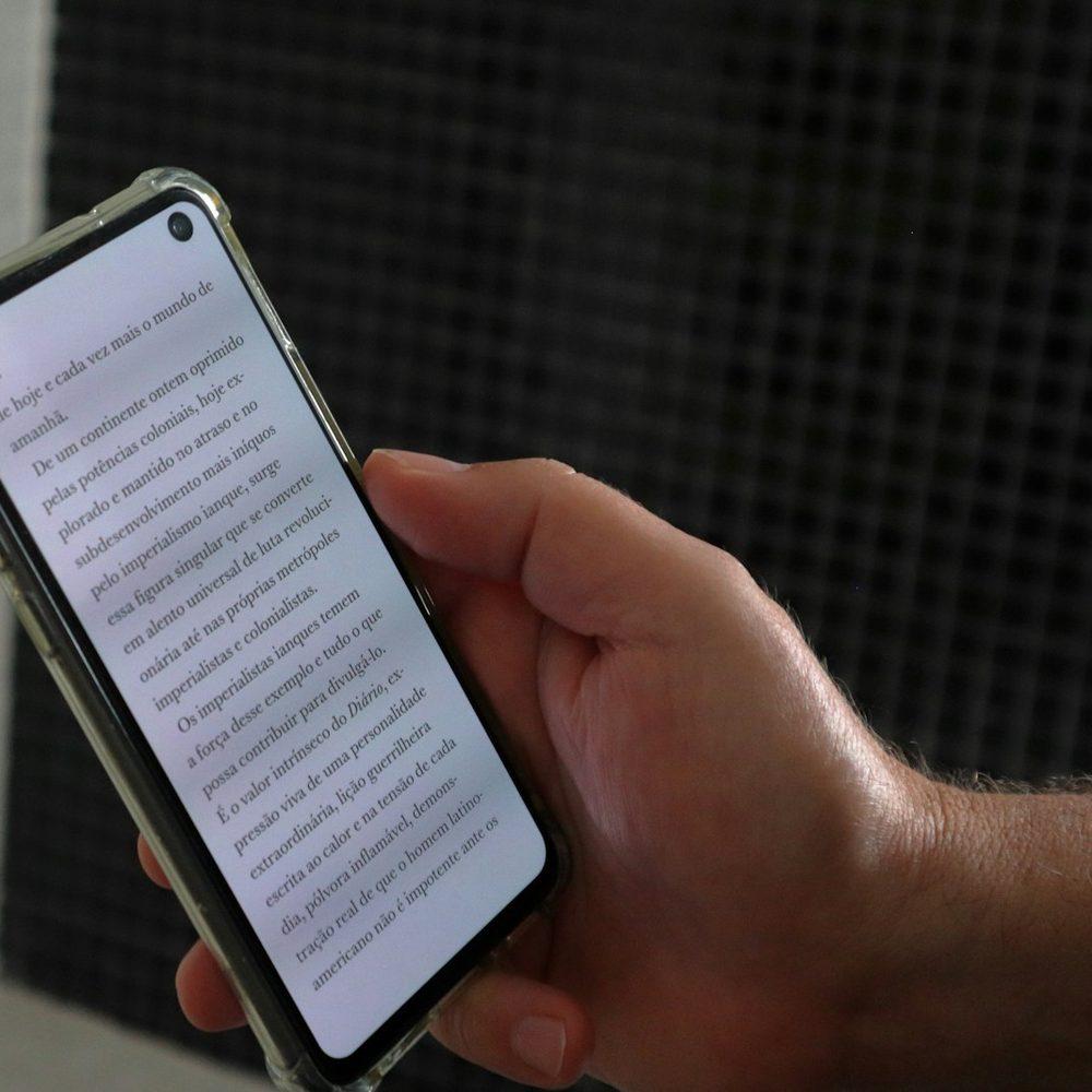 Person reading a transcript on their phone