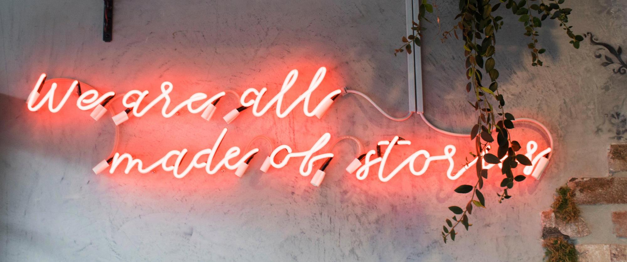 Neon sign - we are all made of stories Neon sign - we are all made of stories